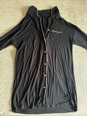 stars above Black Button-Down Shirt with White Piping